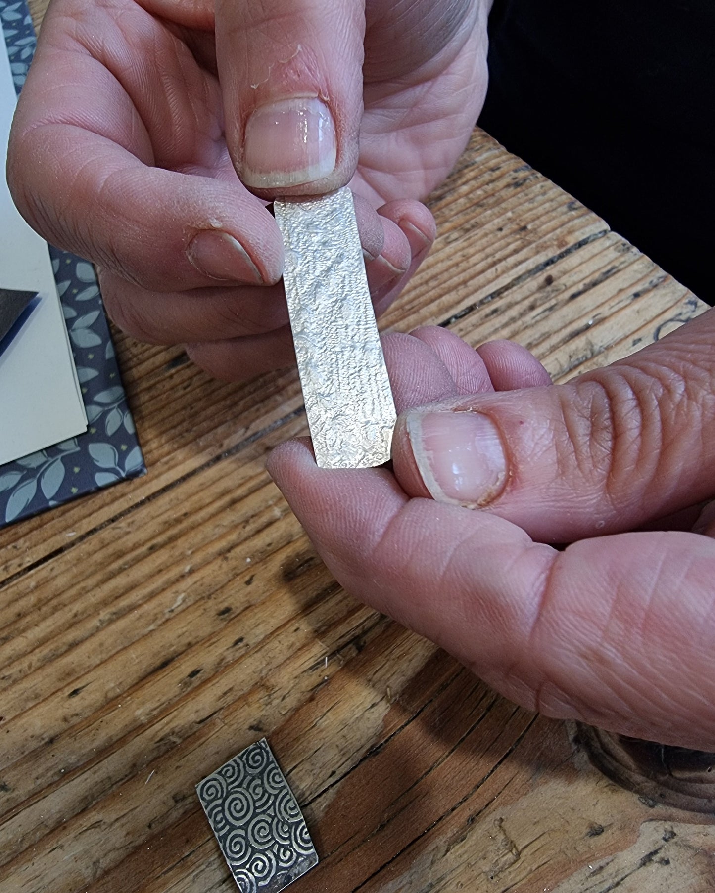 Lace-textured silver pendant